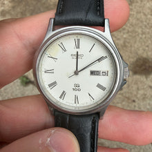 Load image into Gallery viewer, Vintage Late 1970s-early 1980s Quartz S2 100 Roman Numerals Day Date 6923-7010 Dress Watch
